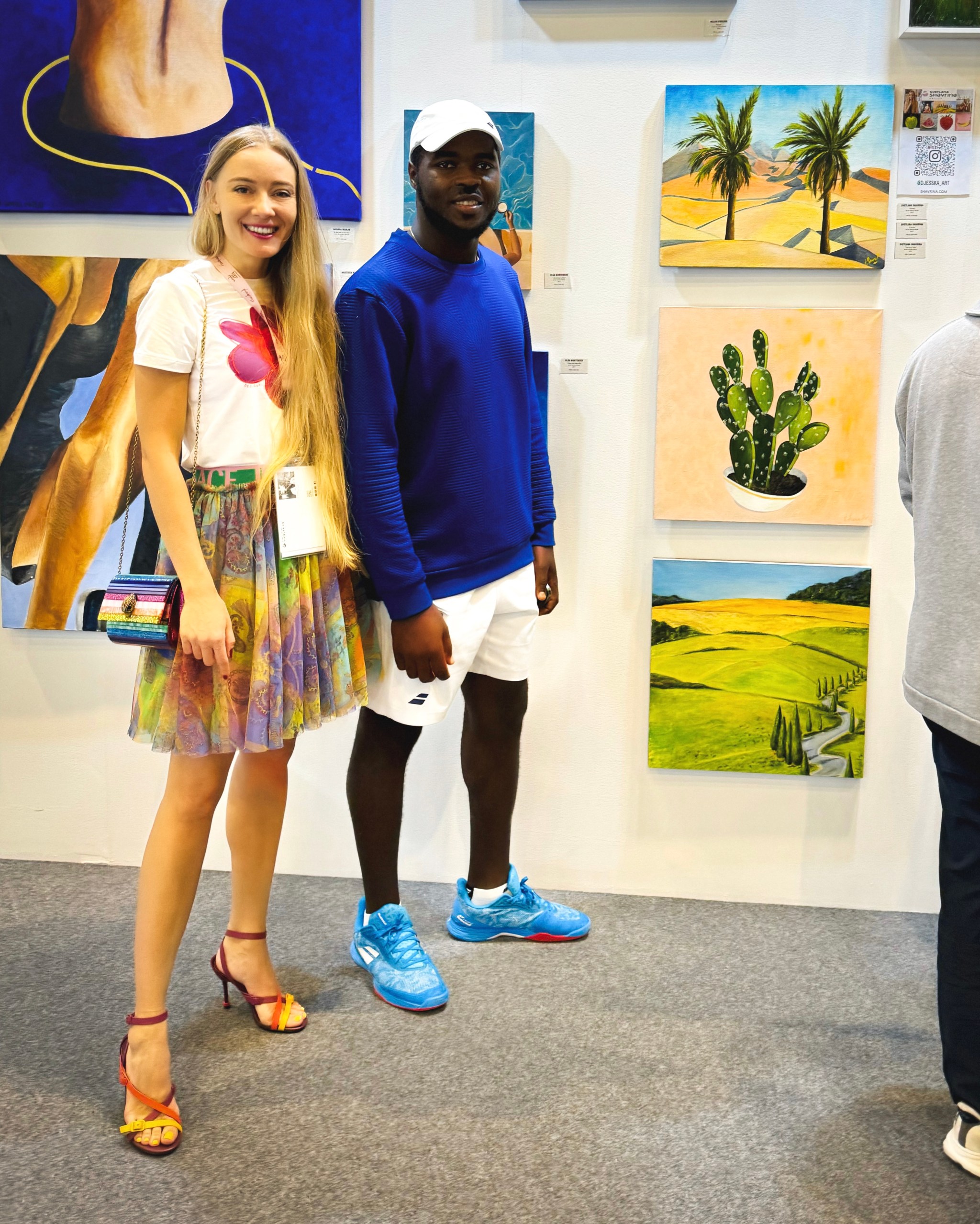 Lana Swan with a visitor at the W&P Gallery stand, World Art Dubai 2024