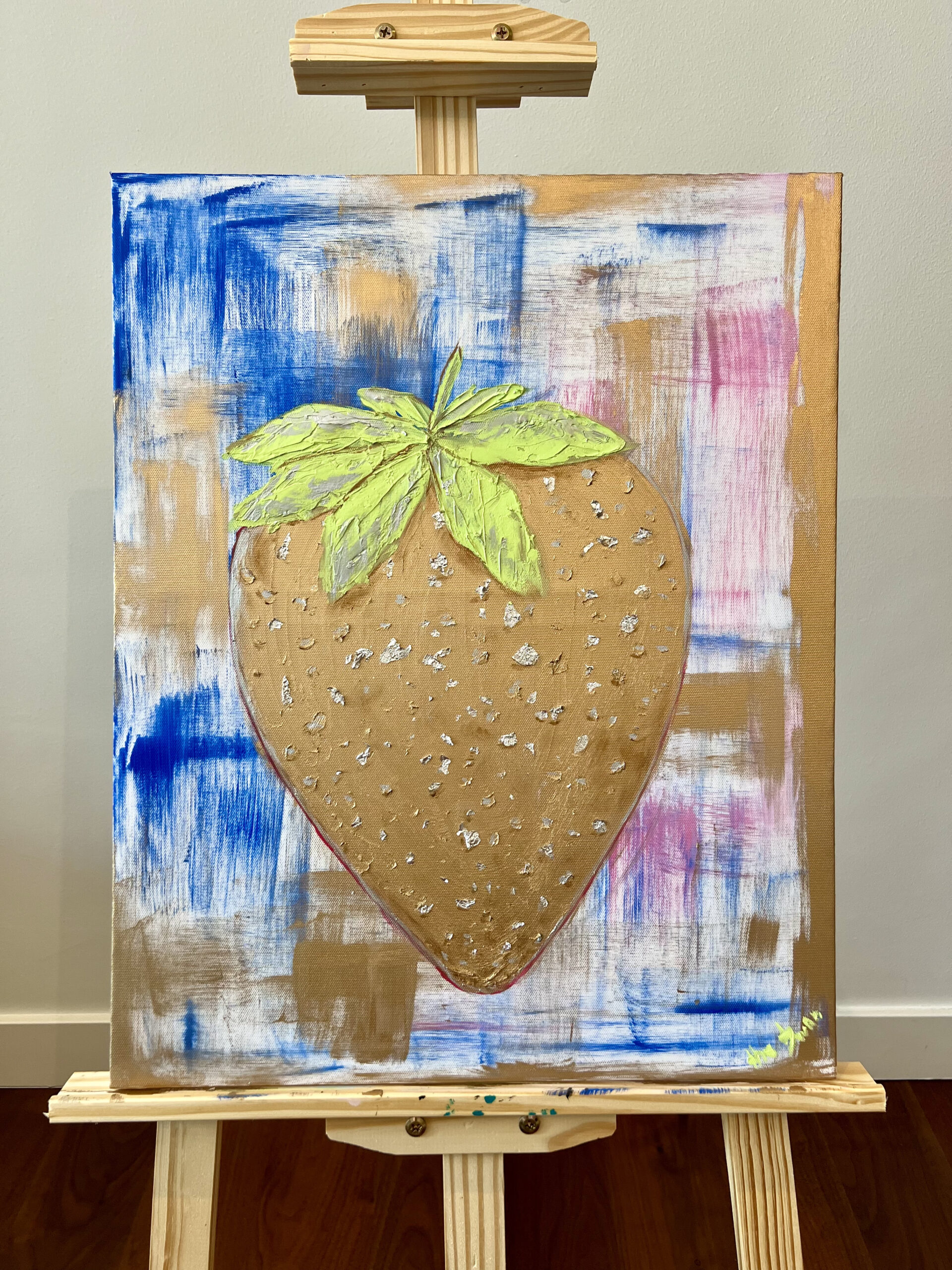 Golden Strawberry oil painting by Lana Swan on a wooden easel
